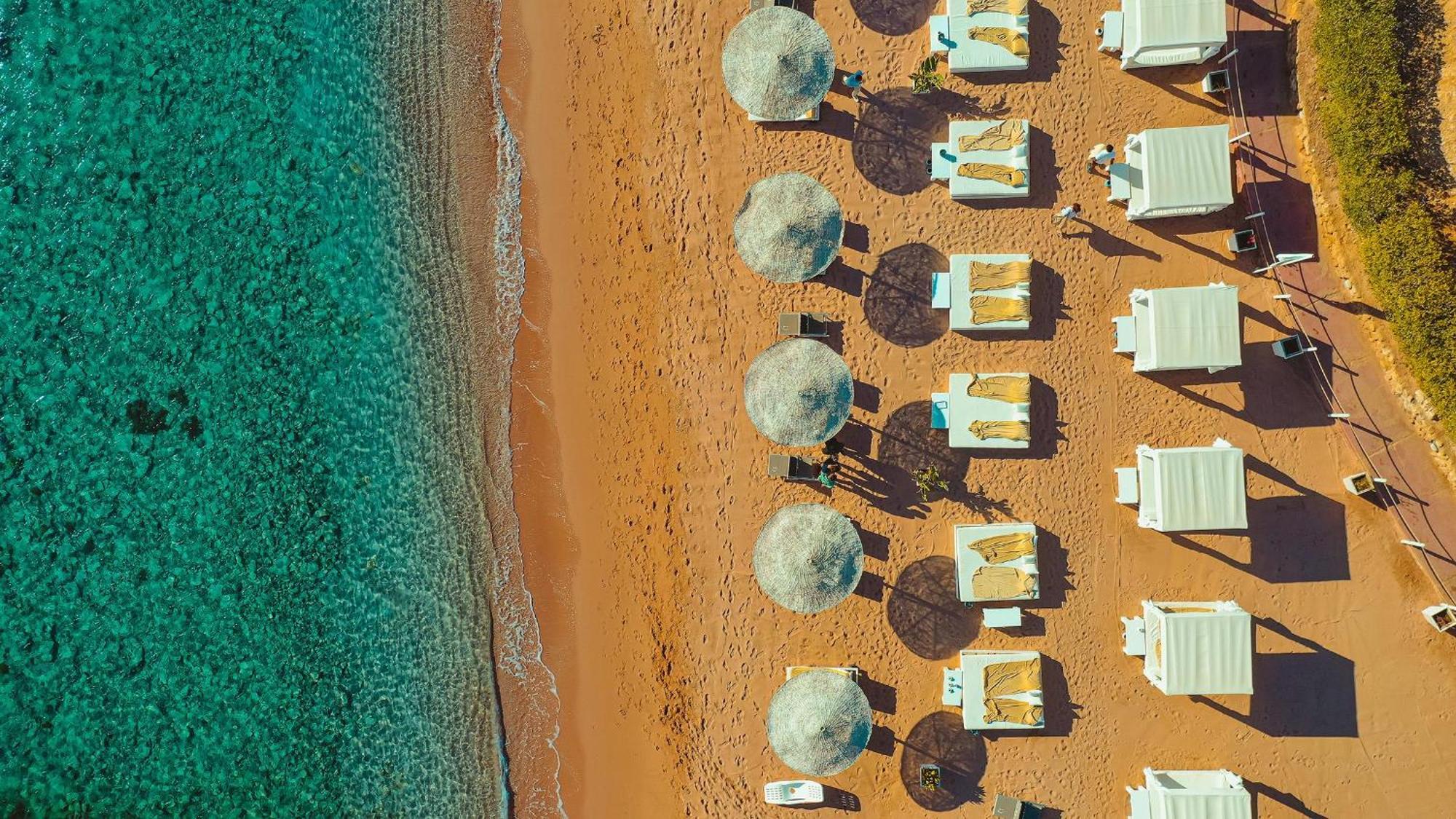 Domina Coral Bay Resort, Diving , Spa & Casino Sharm el Sheikh Esterno foto Aerial view of the beach